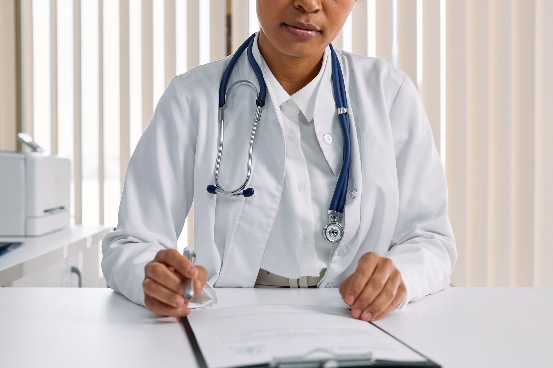 Physician reviewing tax planning documents in a clinic office